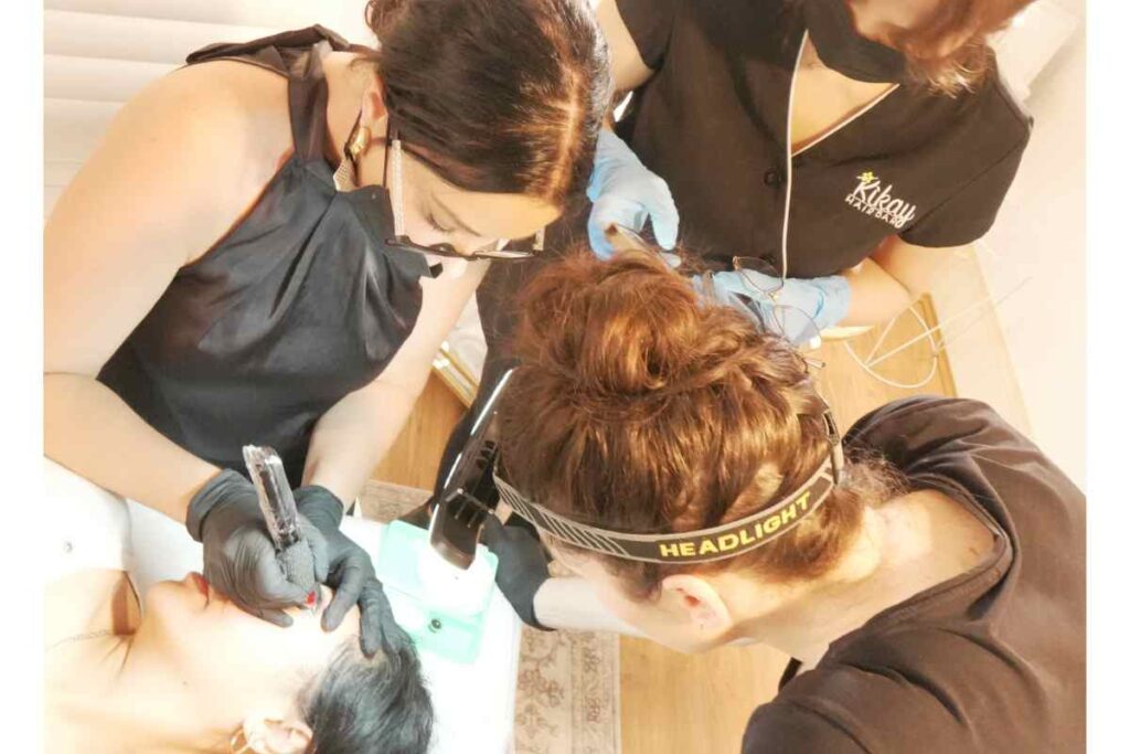 In person cosmetic tattoo training trainer wiht students