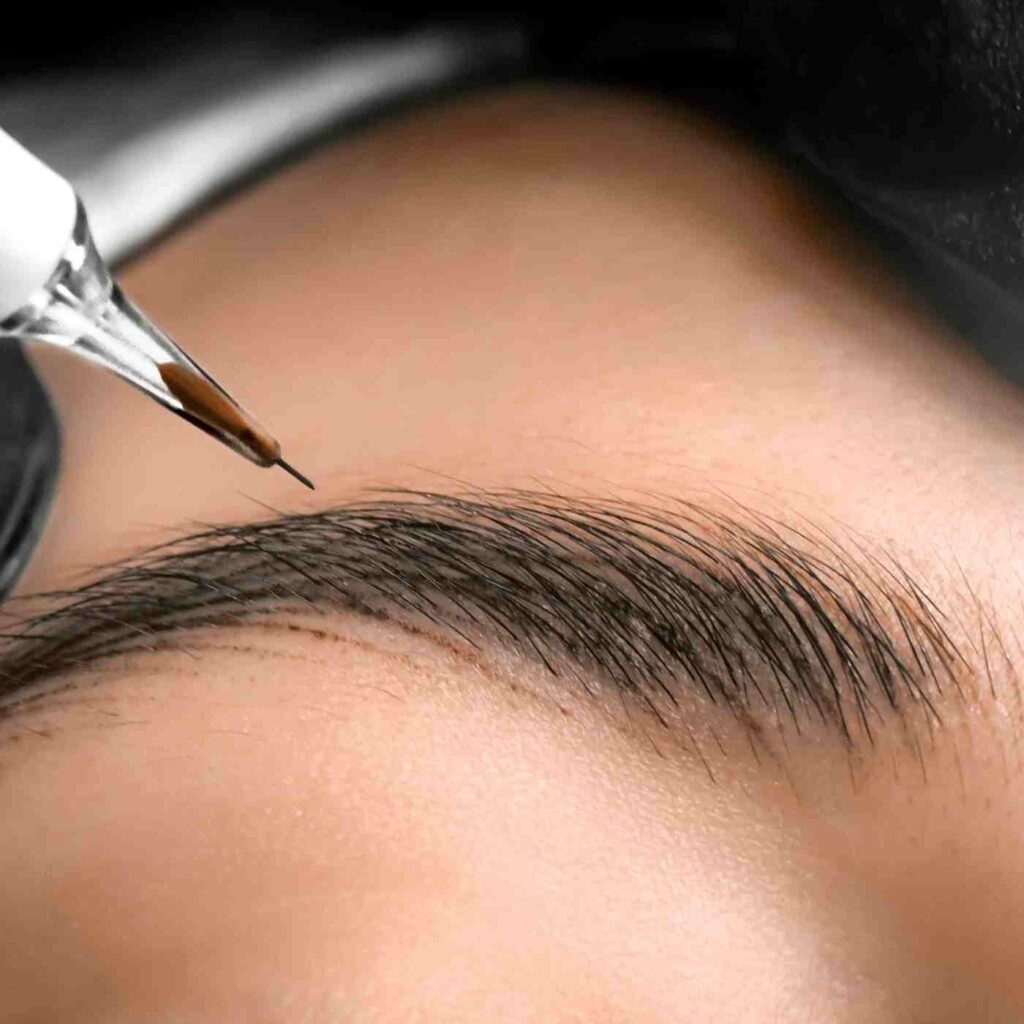Nano Eyebrow microblading procedure taking place in a beauty clinic with skilled professional using precise technique on a client