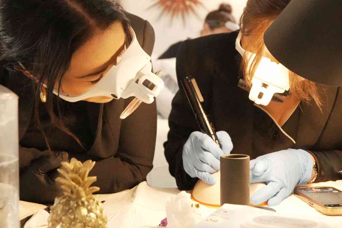 Students working on Ombre and Powder Brow practice skins at Institute of Ink