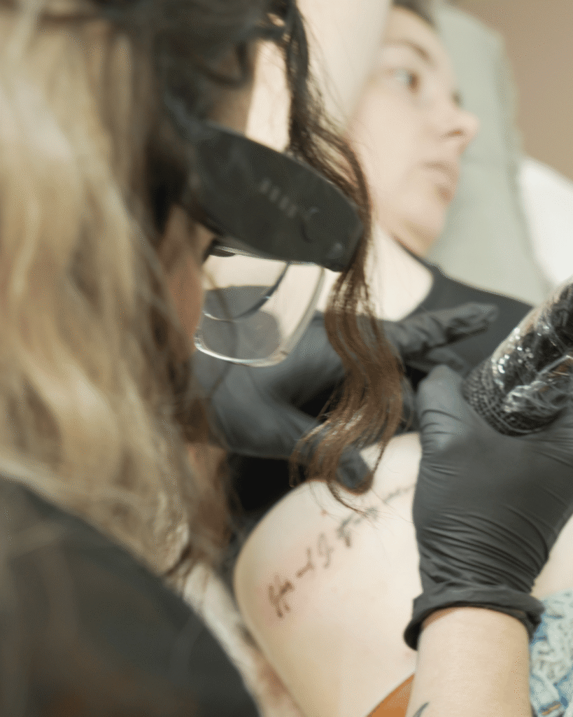 Student practicing Fine Line Tattoo In person training with Institute of Ink