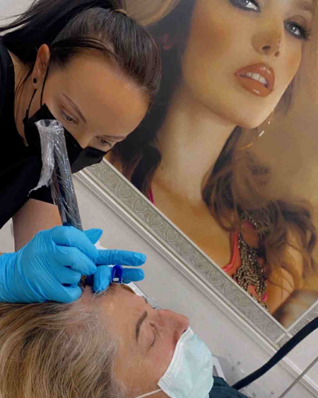Student performing scalp micropigmentation during practical training Brisbane